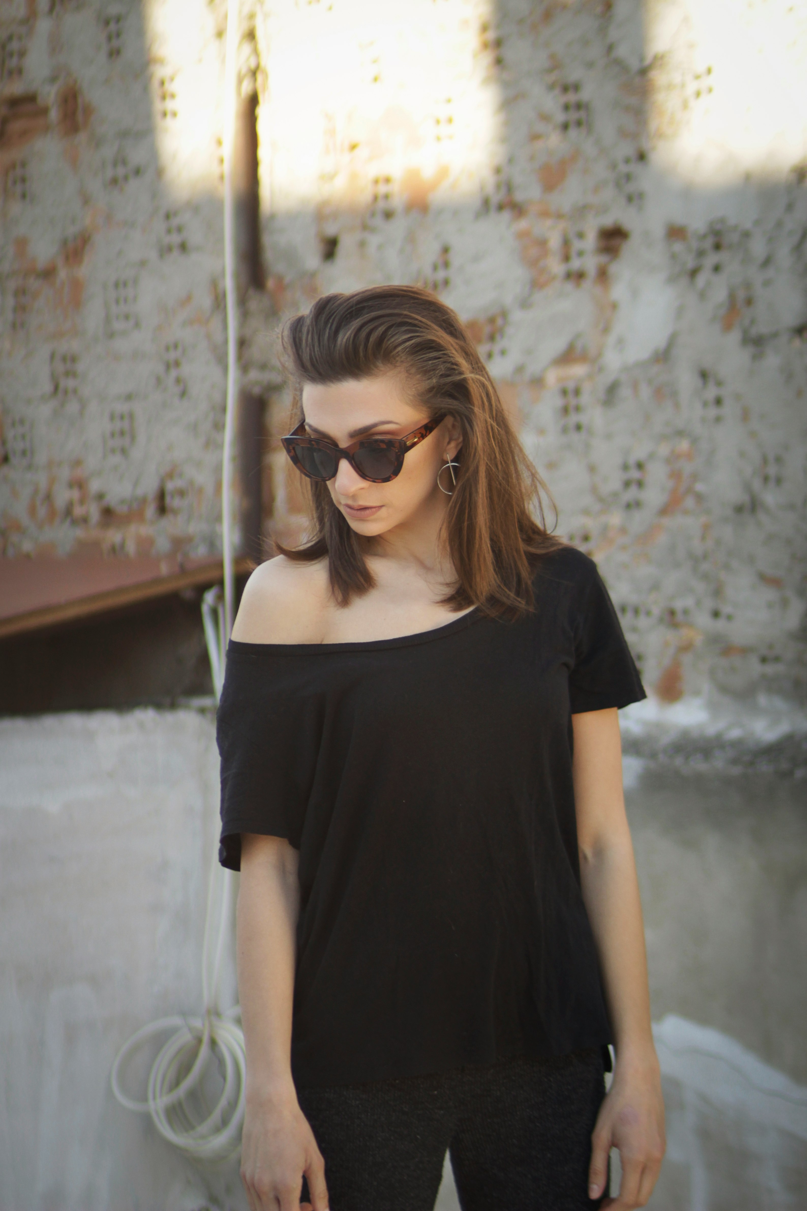 woman in black crew neck t-shirt wearing black sunglasses